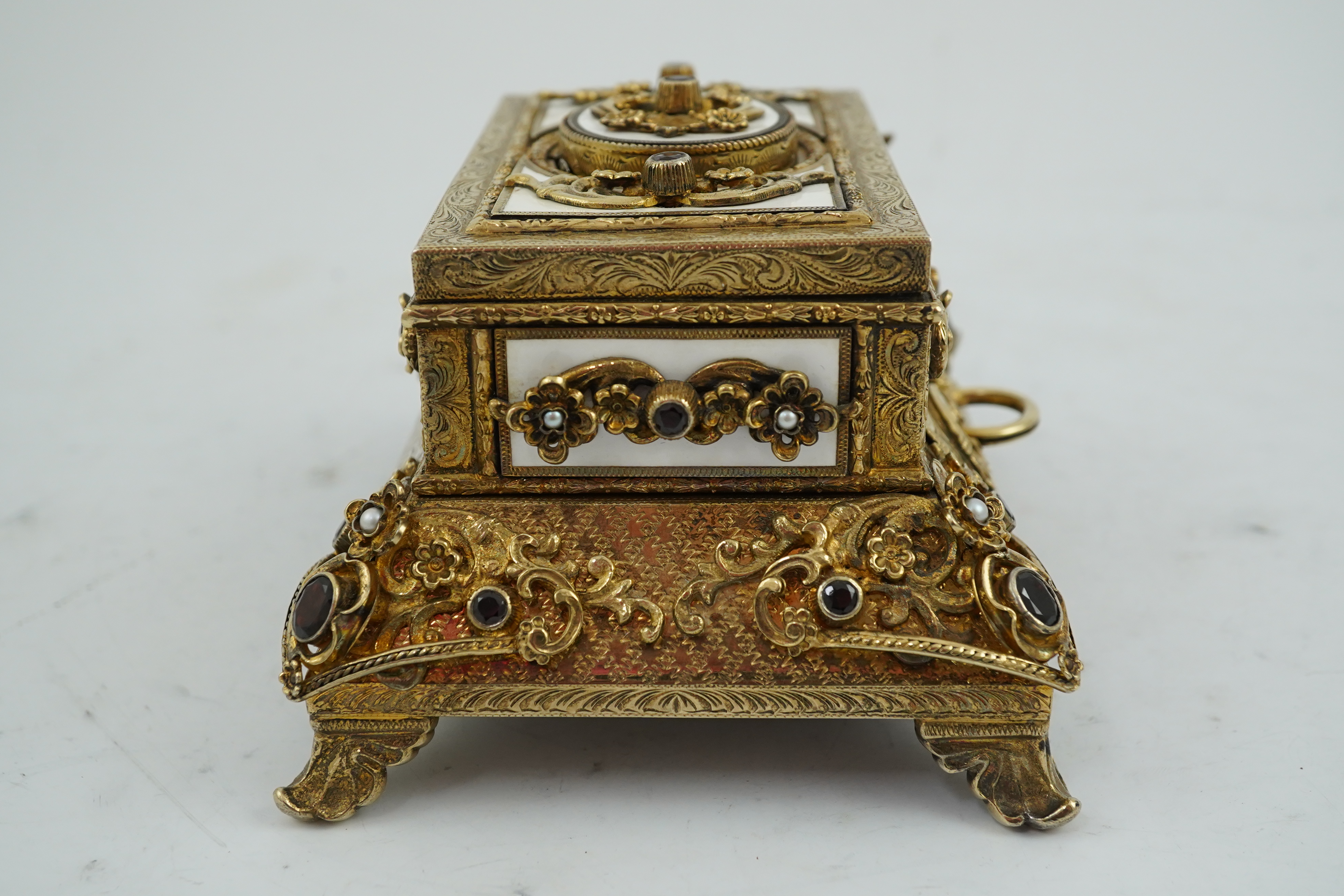 A late Karl Griesbaum Model 17 silver gilt, white enamel, garnet and cultured pearl set automaton singing bird box